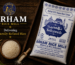 Arham Rice Mill Tehzeeb rice packaging with premium refined rice grains on a wooden background