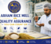 Arham Rice Mill quality assurance process with expert inspecting rice grains in modern hygienic rice processing facility